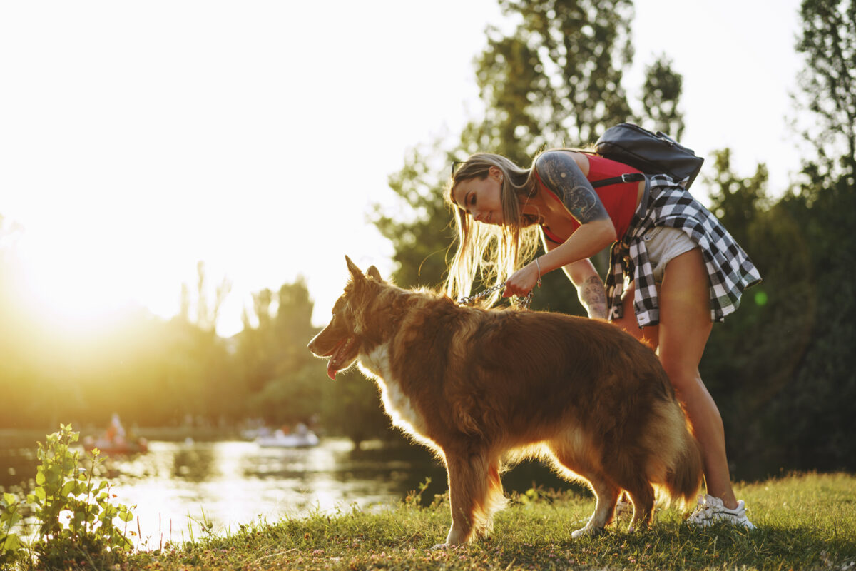 Woman at the lake with her dog